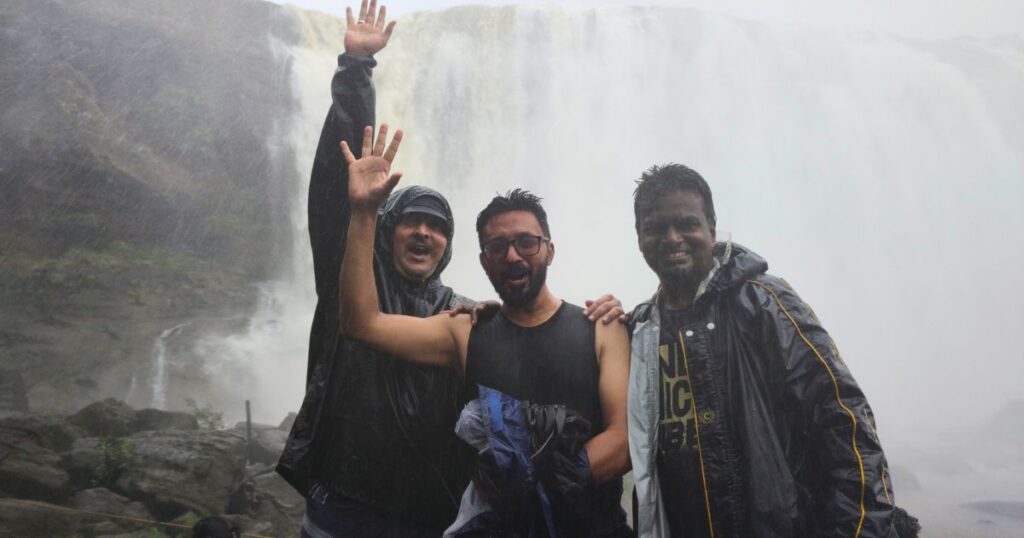 Elite Journeys team at Athirappilly Waterfalls, Kerala — Ravishankar, Gnanyiar and team enjoying South India's most spectacular waterfall experience